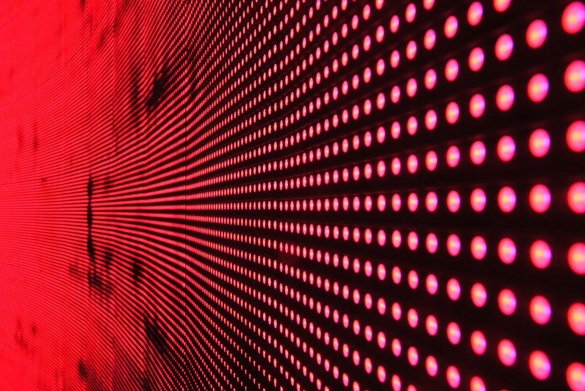A panel of illuminated red lights.